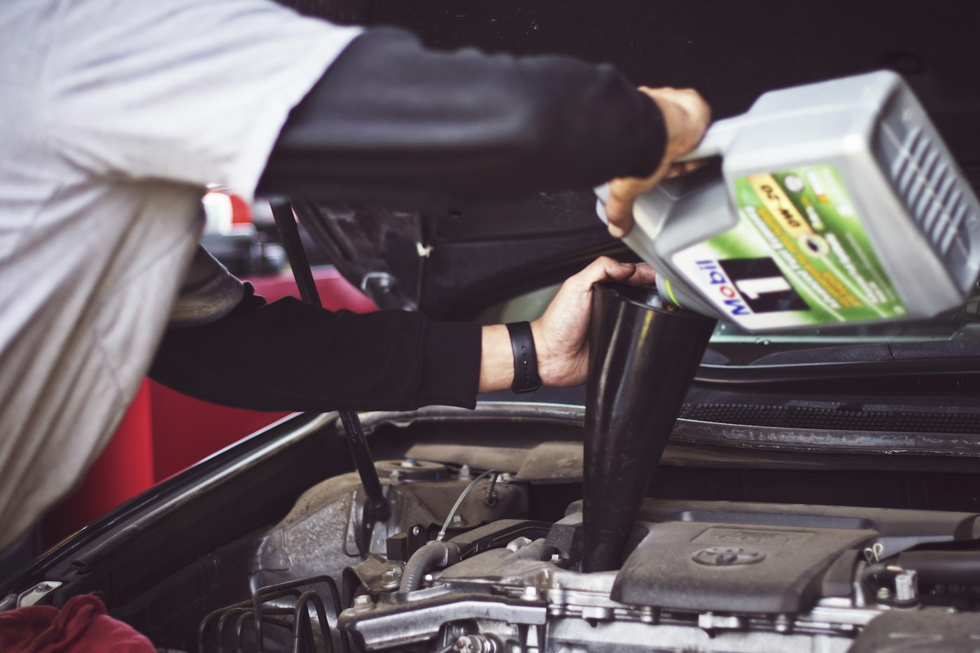 Workshop with a vehicle raised for inspection